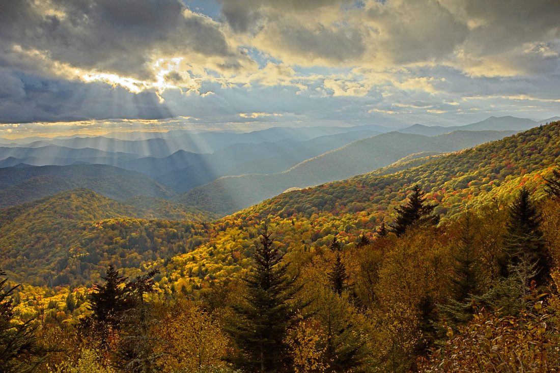 Autumn ridges glowing in warm golden hour light